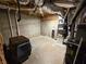 Unfinished basement, furnace, dog cage, and concrete floors at 1045 River Pt, Suwanee, GA 30024