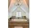 Bright bathroom features a chandelier, large tub, and window with plantation shutters at 1045 River Pt, Suwanee, GA 30024