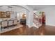 Dining room features a large table, modern lighting, and access to the staircase at 1045 River Pt, Suwanee, GA 30024