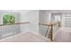 Bright open hallway with natural light and beautiful staircase at 1045 River Pt, Suwanee, GA 30024