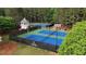 Grand Cascades features well-maintained tennis courts, gazebo, and spectator seating for recreational enjoyment at 1045 River Pt, Suwanee, GA 30024