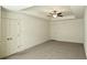Spacious carpeted main bedroom with ceiling fan, tray ceiling, and neutral paint at 340 Auburn Valley Way, Auburn, GA 30011