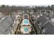 Aerial view of a community featuring townhomes and a community pool area at 6711 Cadence Blvd, Atlanta, GA 30328