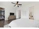 Spacious bedroom featuring an en-suite bathroom, walk-in closet, and a ceiling fan at 6711 Cadence Blvd, Atlanta, GA 30328