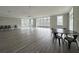 Spacious common room featuring large windows, modern flooring, and ample seating area at 6711 Cadence Blvd, Atlanta, GA 30328