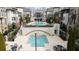 Community pool area featuring lounge chairs and tables for residents at 6711 Cadence Blvd, Atlanta, GA 30328