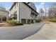 Three story townhome featuring multiple balconies and attached two car garages at 6711 Cadence Blvd, Atlanta, GA 30328