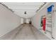 Clean garage interior featuring ample storage space and ladder at 6711 Cadence Blvd, Atlanta, GA 30328