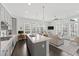 Open kitchen flows into the living area, boasting an island, great lighting, and modern appliances at 6711 Cadence Blvd, Atlanta, GA 30328