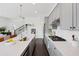 Bright kitchen featuring stainless steel appliances, subway tile backsplash, and a large island with a sink at 6711 Cadence Blvd, Atlanta, GA 30328