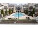 Resort style pool with lounge chairs and meticulously maintained landscaping and clubhouse at 6711 Cadence Blvd, Atlanta, GA 30328