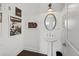 Bright powder room featuring a pedestal sink, an oval mirror, and art gallery wall at 6711 Cadence Blvd, Atlanta, GA 30328