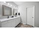 Bathroom boasts double sinks, ample counter space, and neutral paint, offering a clean aesthetic at 129 Prominence Ct, Canton, GA 30114