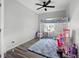 Bright bedroom featuring a carpet rug, bunkbed, and a ceiling fan at 129 Prominence Ct, Canton, GA 30114