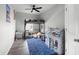 Bright bedroom featuring a carpet rug, bunkbed, and a ceiling fan at 129 Prominence Ct, Canton, GA 30114