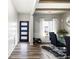 Modern dining room with wood beams, wainscoting, and stylish furnishings at 129 Prominence Ct, Canton, GA 30114