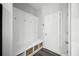 Mudroom features a built in bench with storage and hooks for coats at 129 Prominence Ct, Canton, GA 30114