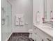 Contemporary bathroom featuring a glass shower, marble floors, and sleek white vanity at 1717 N Decatur Ne Rd # 303, Atlanta, GA 30307