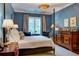 A serene bedroom with a four-poster bed, custom draperies, and decorative furnishings at 1717 N Decatur Ne Rd # 303, Atlanta, GA 30307