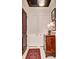 An inviting foyer with a classic rug, chest of drawers, and clean white closet doors at 1717 N Decatur Ne Rd # 303, Atlanta, GA 30307