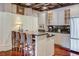 Modern kitchen features a breakfast bar, granite countertops, and stainless steel appliances at 1717 N Decatur Ne Rd # 303, Atlanta, GA 30307