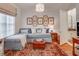 Cozy living room with a plush sectional sofa, hardwood floors, and bright natural light at 1717 N Decatur Ne Rd # 303, Atlanta, GA 30307