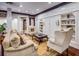 Elegant living room with custom built-ins, refined furniture, and hardwood floors at 1717 N Decatur Ne Rd # 303, Atlanta, GA 30307