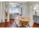 A combined dining and living space featuring a large wooden table and comfortable seating area at 1717 N Decatur Ne Rd # 303, Atlanta, GA 30307
