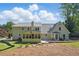 Backyard features a screen porch and large lawn, great for entertaining and recreation at 4824 Dunwoody Station Dr, Atlanta, GA 30338
