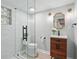 Modern bathroom features a glass-enclosed shower, single vanity, and updated fixtures at 4824 Dunwoody Station Dr, Atlanta, GA 30338