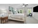 Bright and airy bedroom with a four-poster bed, side tables, and lots of natural light at 4824 Dunwoody Station Dr, Atlanta, GA 30338