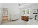 Bright Bedroom with crib, dresser, and plenty of natural light from the window at 4824 Dunwoody Station Dr, Atlanta, GA 30338