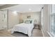 Cozy bedroom with natural light features neutral walls and an ensuite bathroom at 4824 Dunwoody Station Dr, Atlanta, GA 30338
