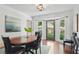 Cozy dining area featuring a table with chairs, a bay window and a view to the yard at 4824 Dunwoody Station Dr, Atlanta, GA 30338