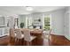 Formal dining room with wood floors, natural light, and seating for six at 4824 Dunwoody Station Dr, Atlanta, GA 30338