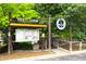 The welcome sign at the Dunwoody Nature Center has a bulletin board, handicap ramp, and trees at 4824 Dunwoody Station Dr, Atlanta, GA 30338