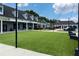 Attractive building exterior with a well-maintained green lawn and multiple store fronts for retail and commercial opportunities at 4824 Dunwoody Station Dr, Atlanta, GA 30338
