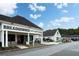 A view of a retail space with Breadwinner Cafe and other shops at 4824 Dunwoody Station Dr, Atlanta, GA 30338
