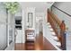 Inviting foyer featuring hardwood floors, staircase with wood banister, and neutral decor at 4824 Dunwoody Station Dr, Atlanta, GA 30338