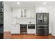 Kitchen featuring stainless steel fridge, wine cooler and ample storage at 4824 Dunwoody Station Dr, Atlanta, GA 30338
