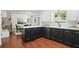Modern kitchen with stainless steel appliances, black and white cabinets, and ample counter space at 4824 Dunwoody Station Dr, Atlanta, GA 30338
