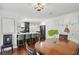 Open-concept kitchen and dining area with a large island and breakfast bar at 4824 Dunwoody Station Dr, Atlanta, GA 30338