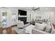 Cozy living room with a fireplace, patio access, and plush furniture at 4824 Dunwoody Station Dr, Atlanta, GA 30338