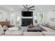 Comfortable living room with a fireplace, ceiling fan, and access to the patio at 4824 Dunwoody Station Dr, Atlanta, GA 30338