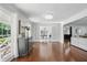 Bright living room with hardwood floors, French doors, and neutral paint colors, offering style at 4824 Dunwoody Station Dr, Atlanta, GA 30338