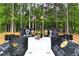 Outdoor memorial for veterans with statues, flags, and inscriptions surrounded by lush greenery at 4824 Dunwoody Station Dr, Atlanta, GA 30338