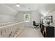 Upstairs hallway with office nook featuring a desk, chair, and storage at 4824 Dunwoody Station Dr, Atlanta, GA 30338