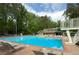 A beautiful community pool with a diving board and lounge chairs for relaxing in the sun at 4824 Dunwoody Station Dr, Atlanta, GA 30338