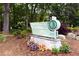 Brook Run Park sign landscaped with colorful plants and a brick base located amongst green trees at 4824 Dunwoody Station Dr, Atlanta, GA 30338