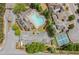 Aerial view showcasing the pool, tennis courts, and the community layout at 620 Stickley Oak Way, Woodstock, GA 30189